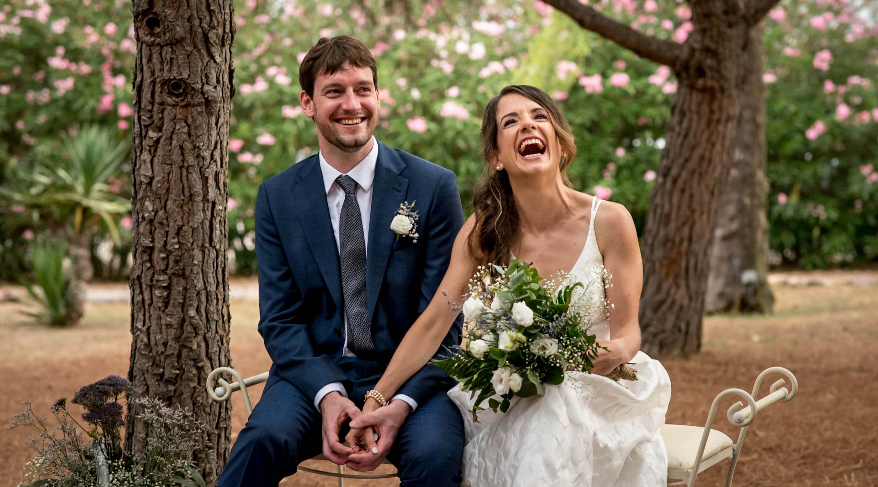Photo of bride and groom laughing during ceremony captured by London wedding photographer Matt Badenoch