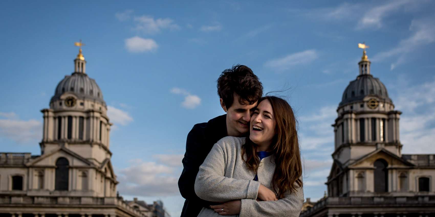 A couple laughing, what to wear on your London engagement photo session