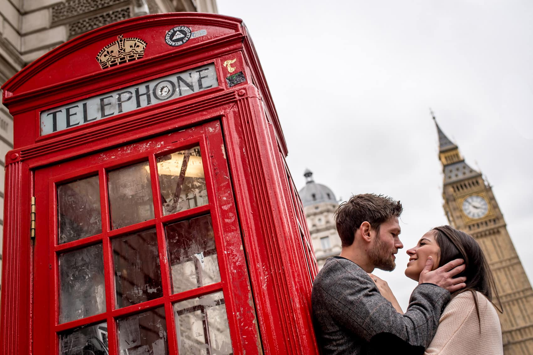 Photo of couple infront of a red phone box during their Big Ben engagement shoot in London