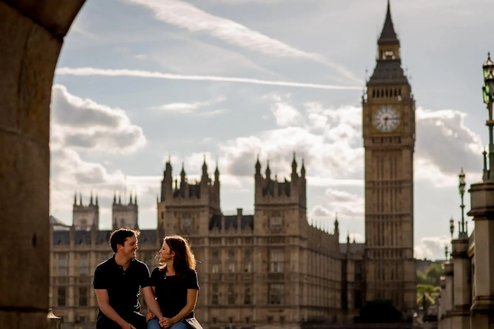 Photo of couple wearing tshirts in front of Big Ben during their London engagement shoot