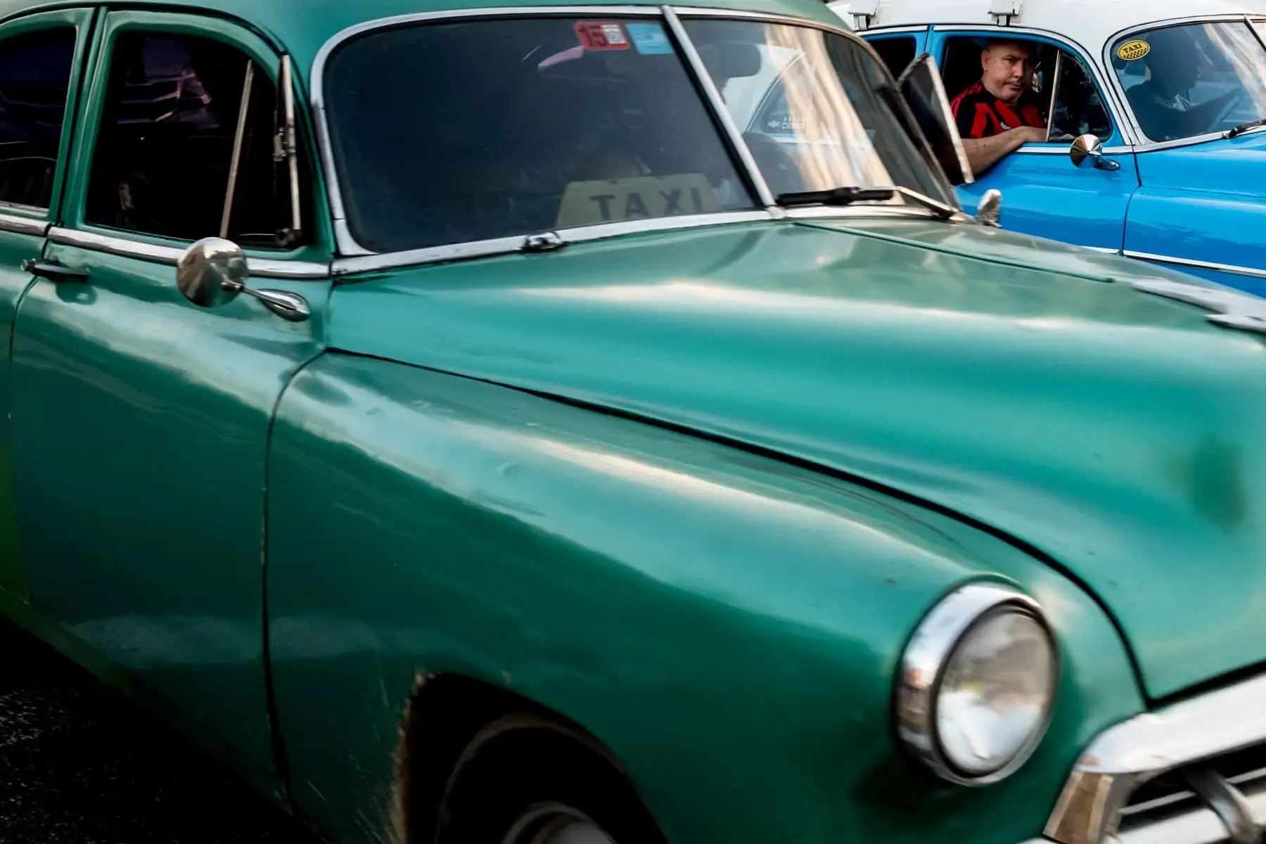 Classic green and blue Cuban cars in havana