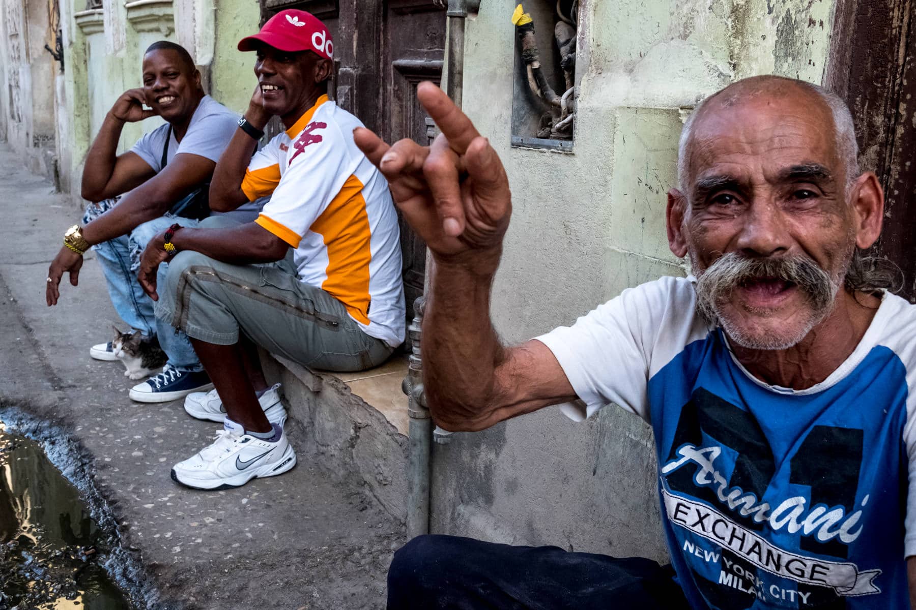 Old men sitting on the street in Havana
