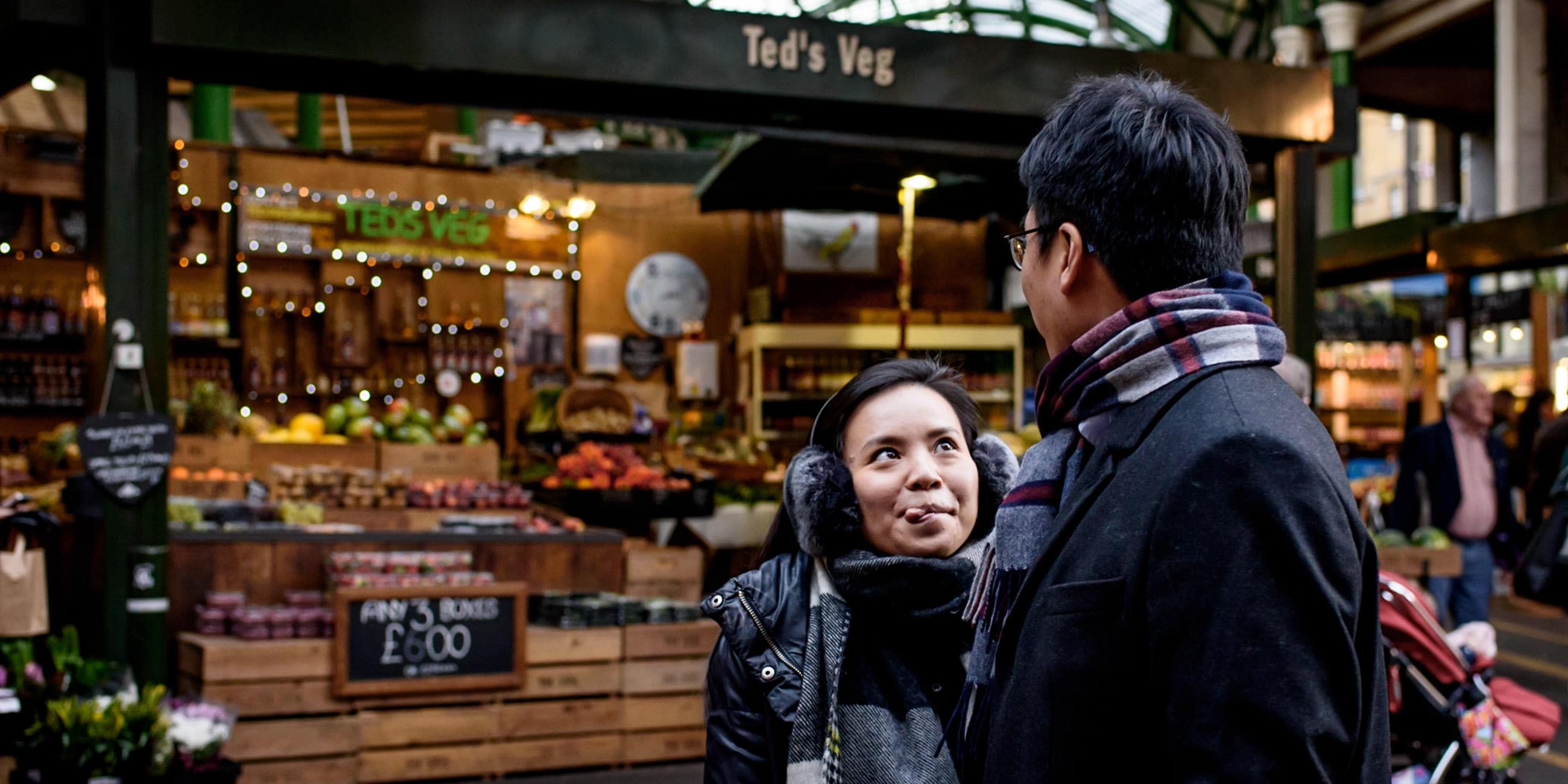 girl sticking her tongue out at borough market during her engagement shoot in London