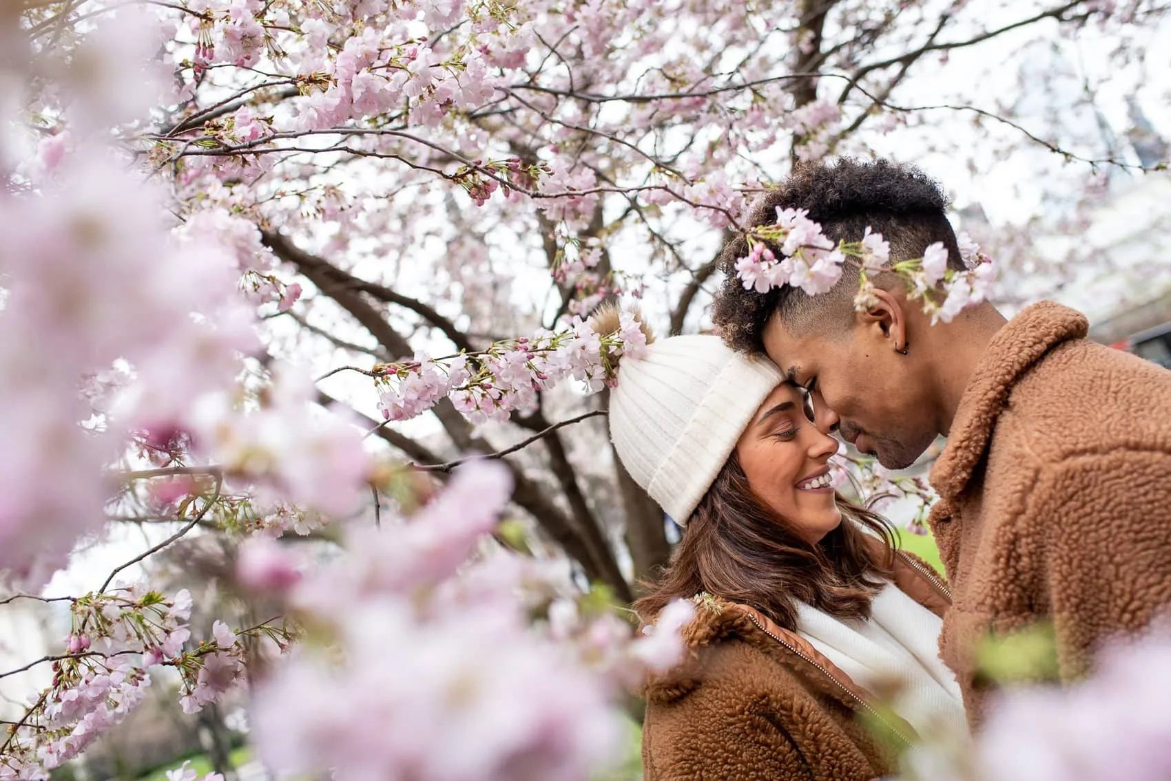 Photo of couple on their Cherry Blossom engagement shoot in London in March