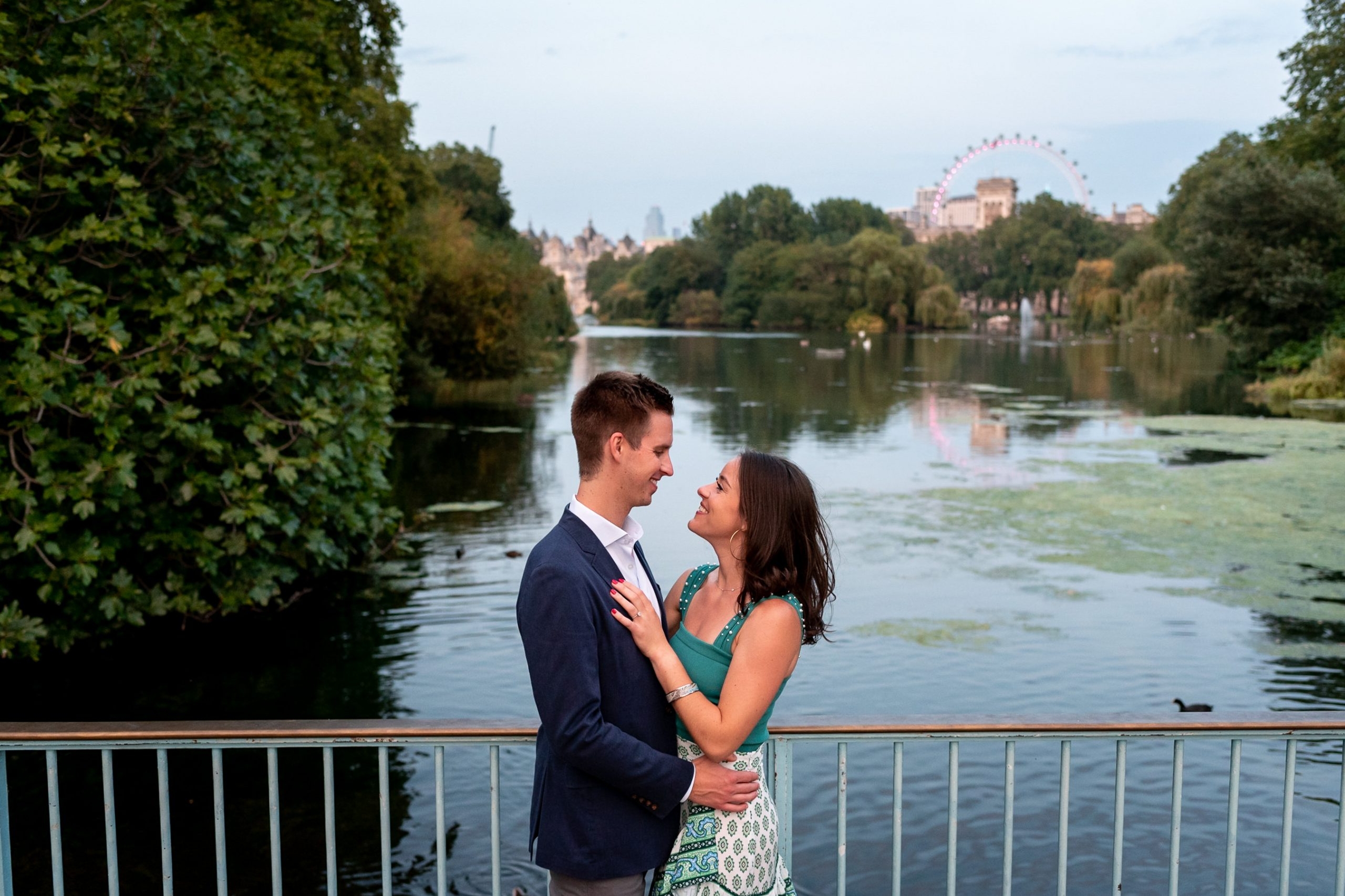photo of couple on their St James Park Engagement Shoot over looking the lake and the London Eye taken by photographer Matt Badenoch
