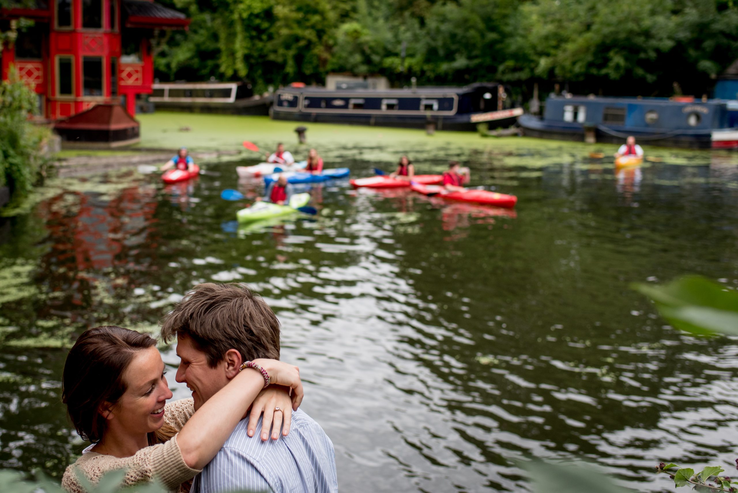 A couple hugging infront of the river in Little Venice, London