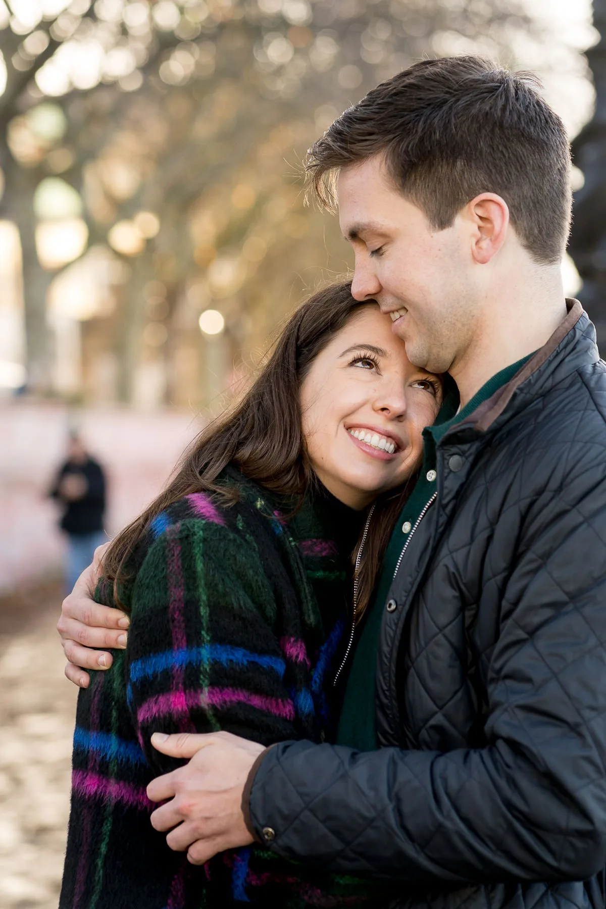 A woman looks up in love at her new fiancé after he proposed to her in Westminster, London