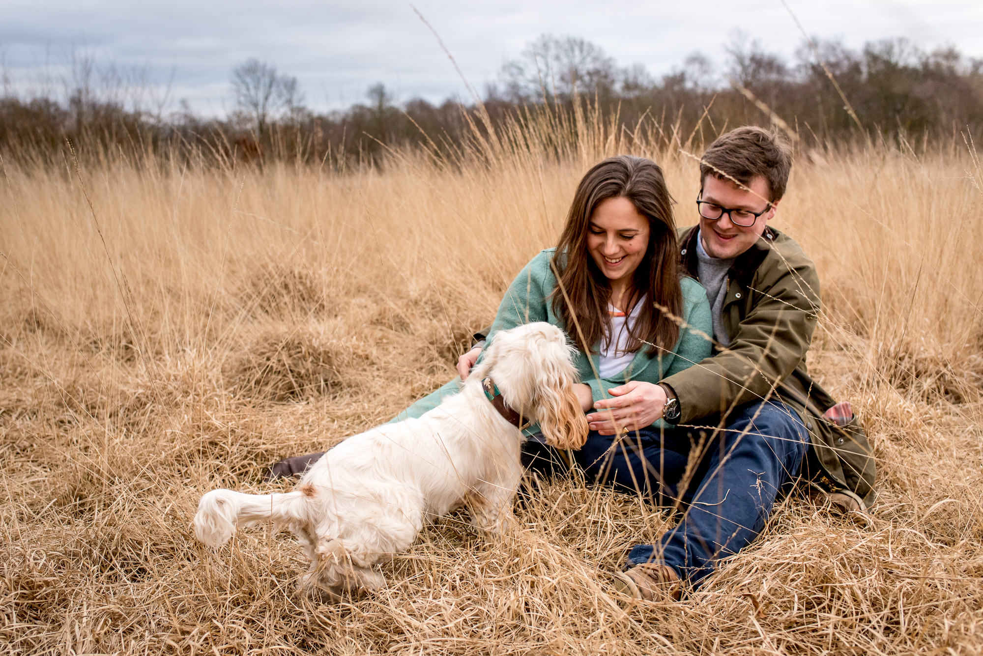 A couple proposes in autumn with their dog