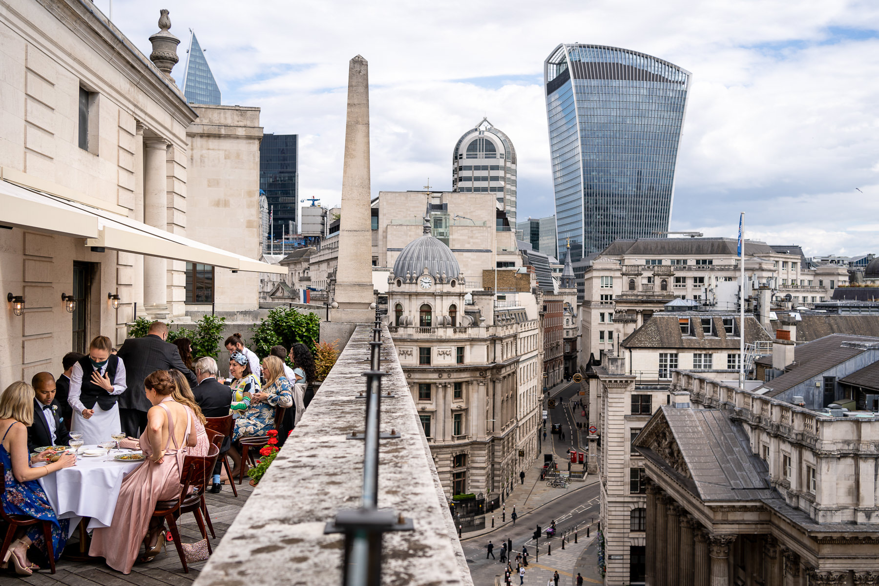 Wedding dinner on the roof top terrace of the Ned, with views overlooking the city of London